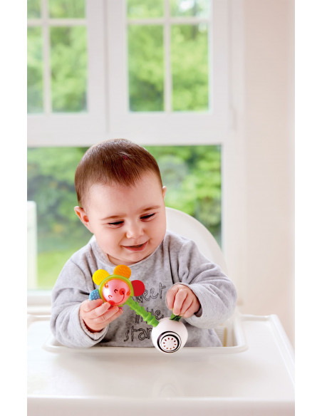 Sonajero de flor agita y brilla